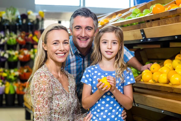 Young happy couple with their daughter