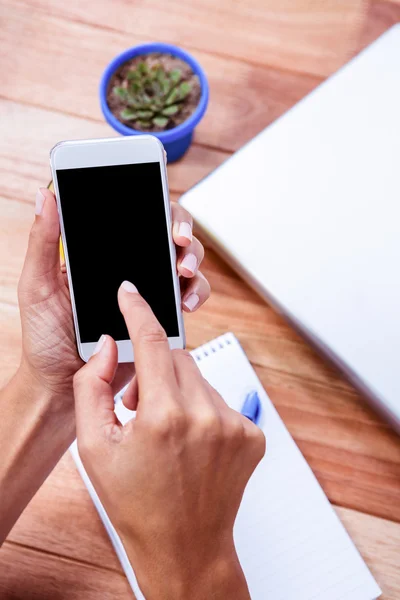 Feminine hands using smartphone