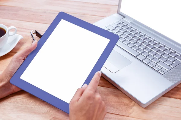 Feminine hands holding tablet