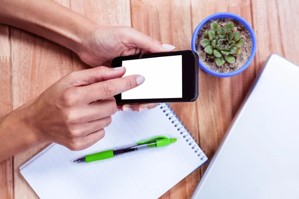 Feminine hands using smartphone