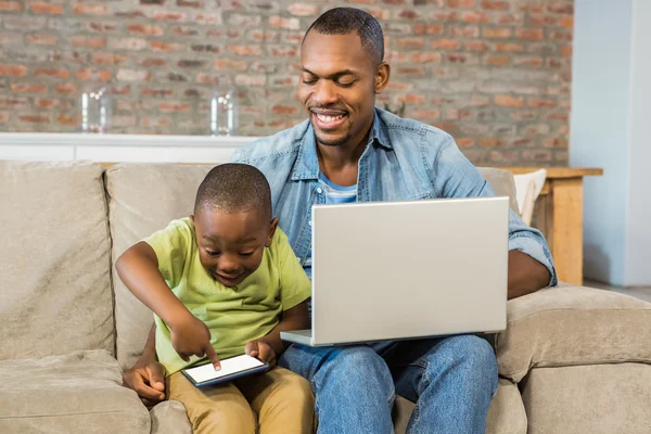 Happy family using technology together