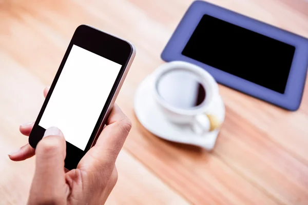 Overhead of feminine hands using smartphone