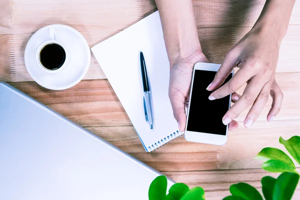 Overhead of feminine hands using smartphone