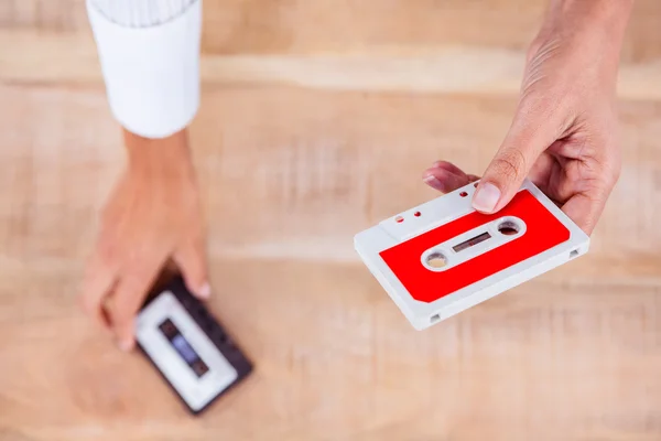 Woman holding old tape