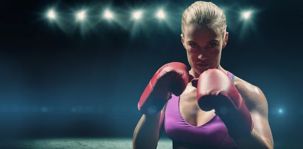 Portrait of woman fighter with gloves