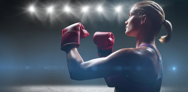 Female boxer with fighting stance