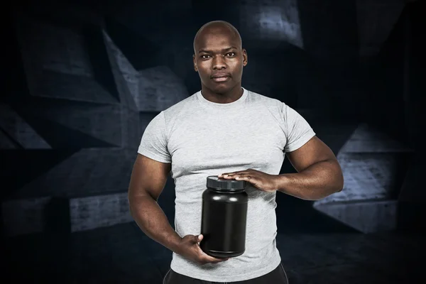 Fit man with protein powder