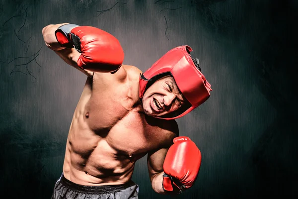 Aggressive boxer against black background