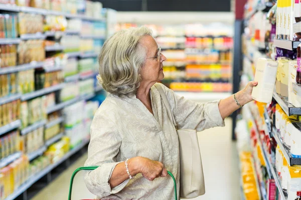 Senior woman buying food