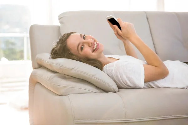 Happy woman holding phone