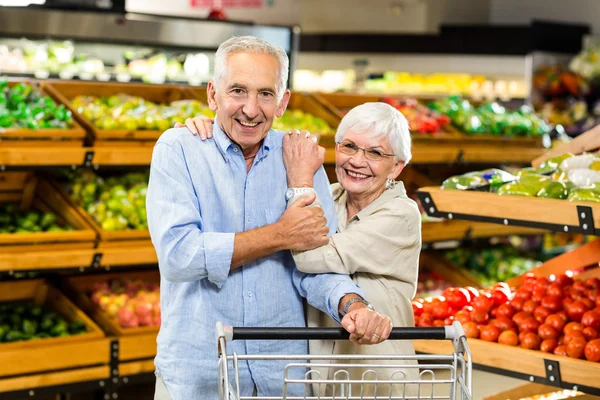 Happy senior couple at the grocery shop