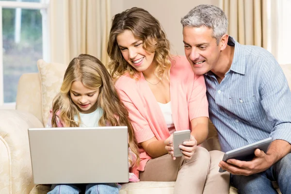 Family looking at laptop screen