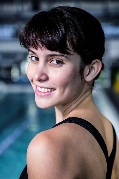 Woman swimmer looking the camera