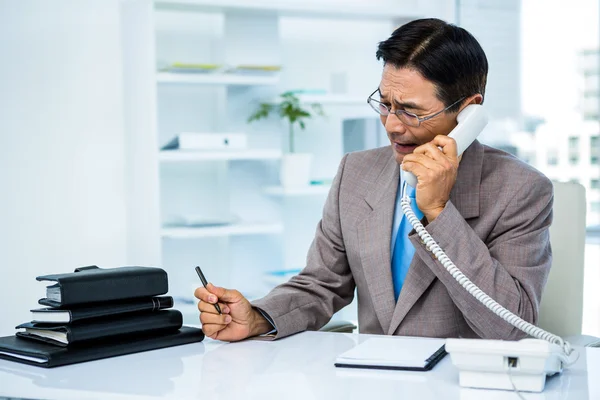 Worried businessman in the phone