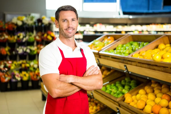 Male worker in grocery store
