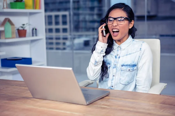 Asian woman shouting on phone call