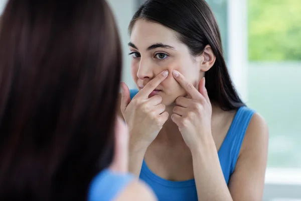 Unhappy woman with skin irritation