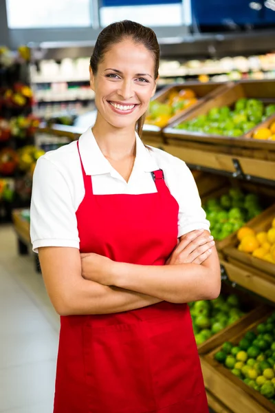 Smiling worker in grocery store
