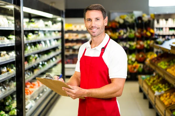 Smiling worker with clipboard