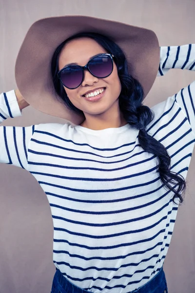 Asian woman with hat and sunglasses