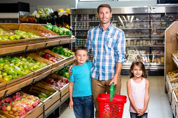 Smiling family in grocery store