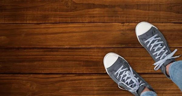 Casual shoes against of wooden planks