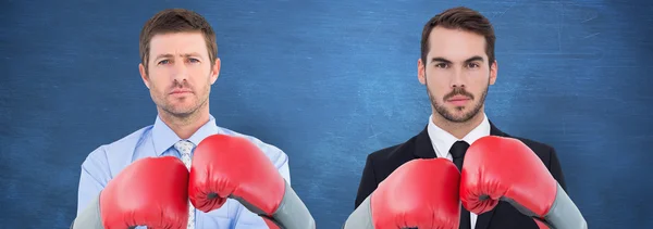 Businessmen with boxing gloves