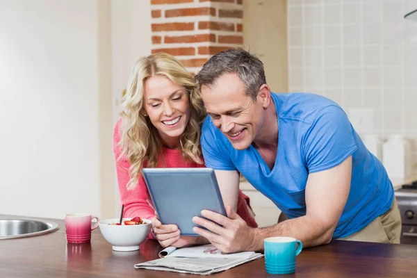 Cute couple looking at tablet