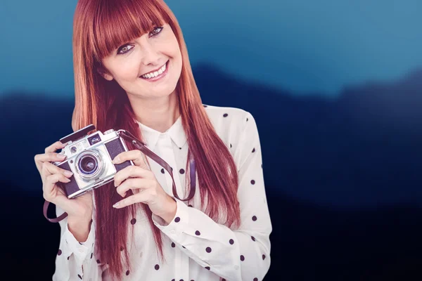 Hipster woman with old fashioned camera