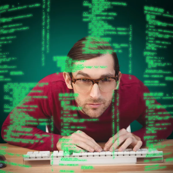 Concentrated man working on computer