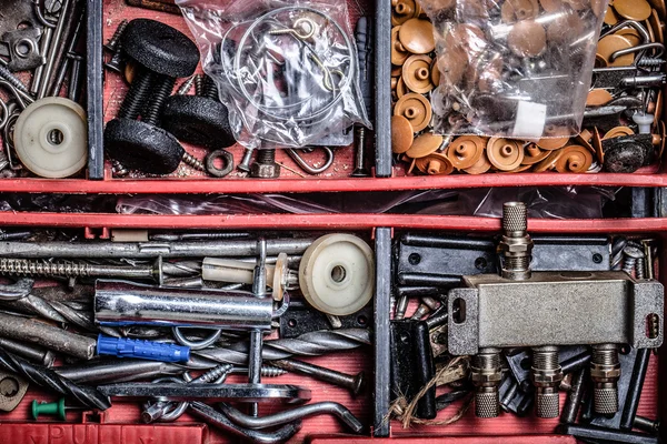 The contents of the old toolbox. Top view. Toned