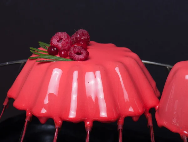 Red mousse cake with berries. Shallow depth of field. Selective