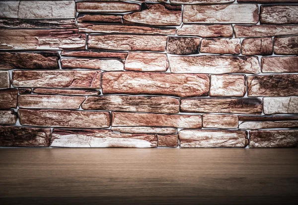 Wooden table and stone wall. Background. The edges are darker.