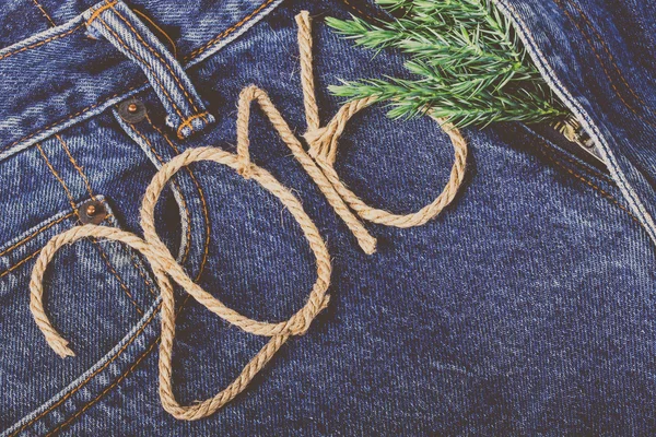 Fresh branch of christmas tree and the numbers 2016 of rope on t