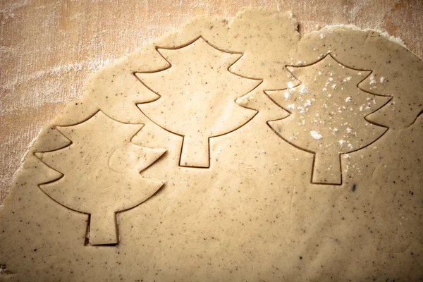 Dough for gingerbread cookie and cookie cutted in different shap