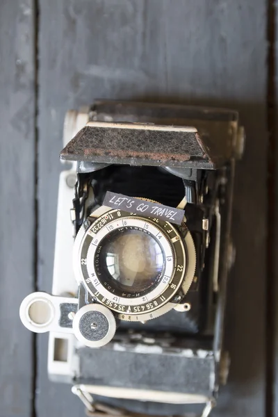 Lets go travel idea. Text and vintage camera.