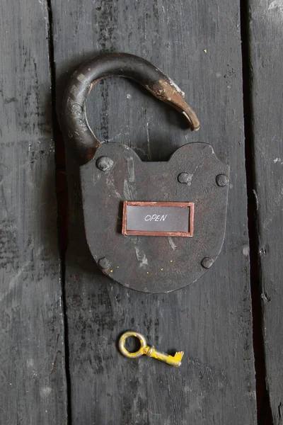 Open sign and old padlock