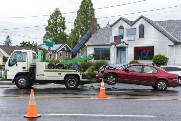 Tow truck removing car after traffic accident