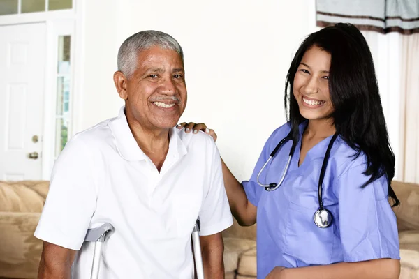 Health Care Worker and Elderly Man