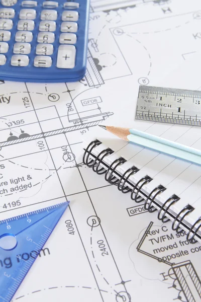 Calculator, Notepad And Drawing Tools Arranged On Plans