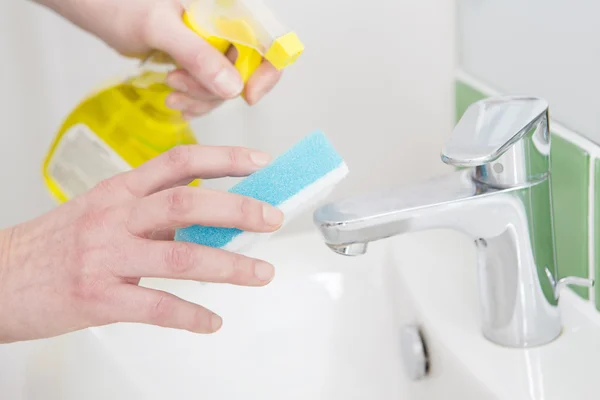 Close Up Of Hands Cleaning Bathroom Sink