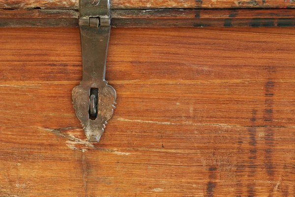 Texture photo of rustic weathered wooden box with metal hinge hasp lock