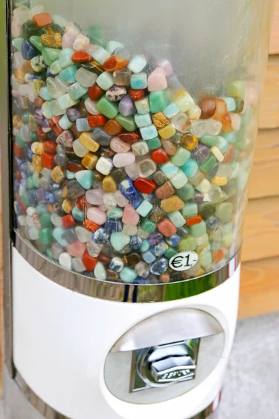 A vending machine full of colorful gemstones