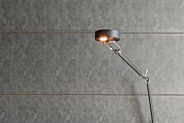 Black reading lamp with gray leather background