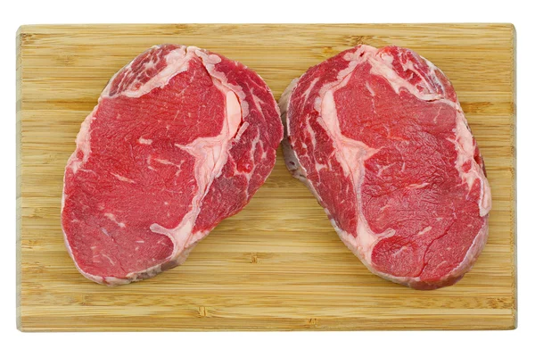 Prime Rib Eye steak on a wooden cutting board