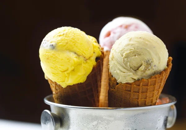 Three cones of different flavor ice cream