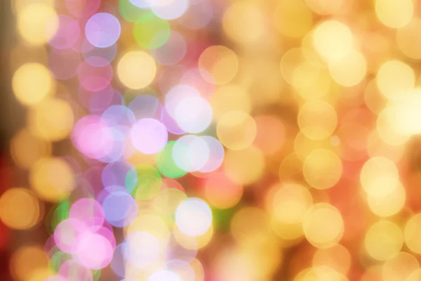 Abstract blurred bokeh light in warm tone background