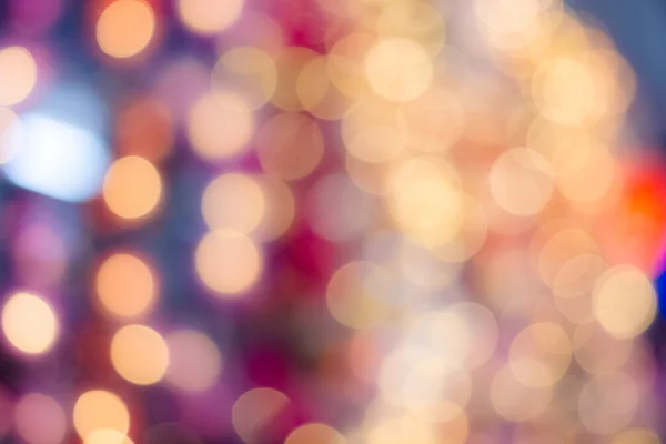 Abstract blurred bokeh light in warm tone background