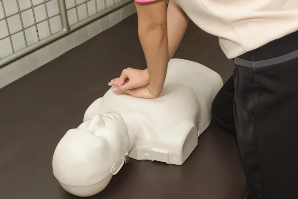 First Aid Instructor Showing Resuscitation CPR Technique
