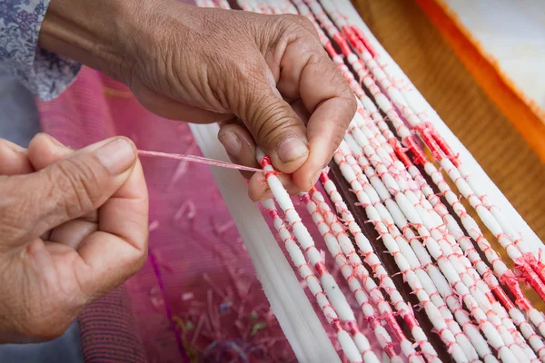 Tie Dye Technique Of Threads Before Weaving Clothes